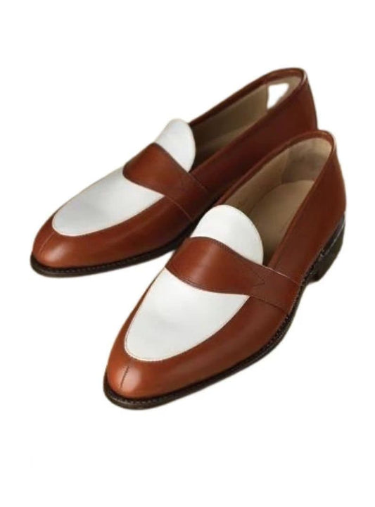 Brown and white loafers on a white background