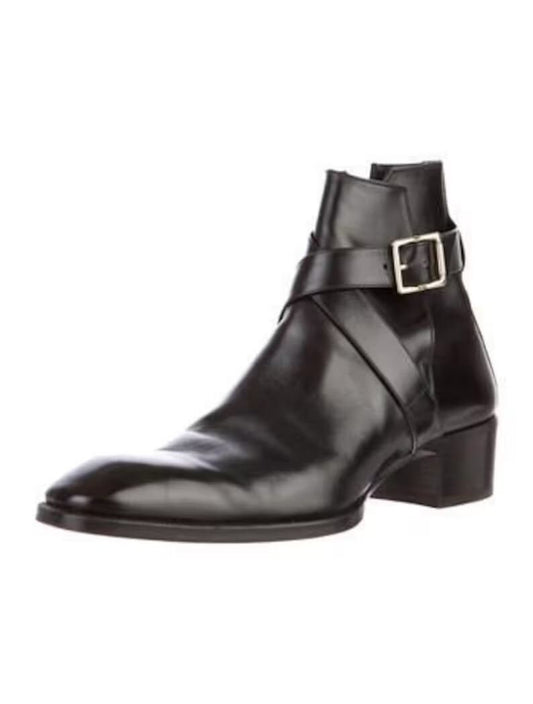 Black leather boot with a buckle on a white background