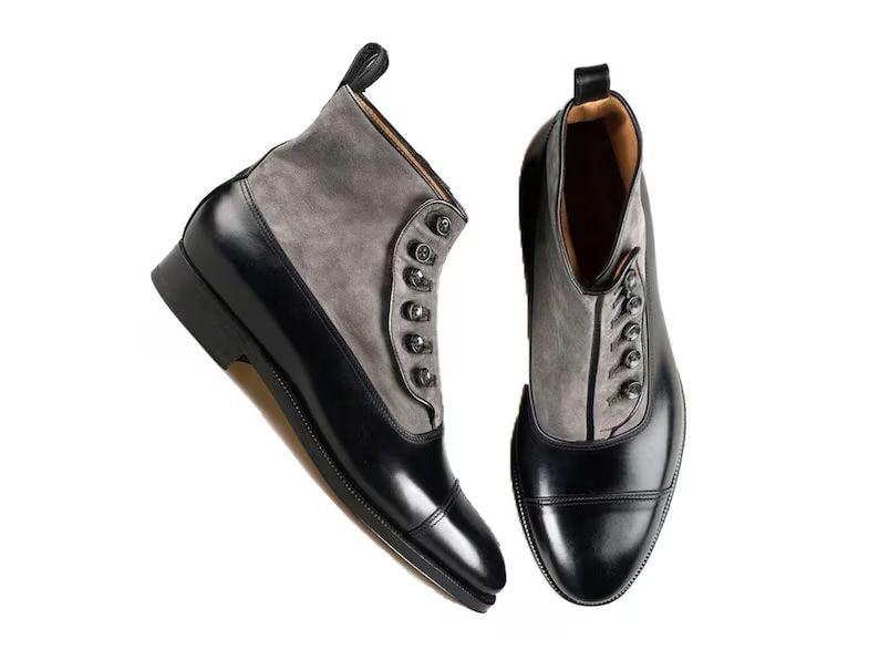 Pair of black and gray dress shoes on a white background