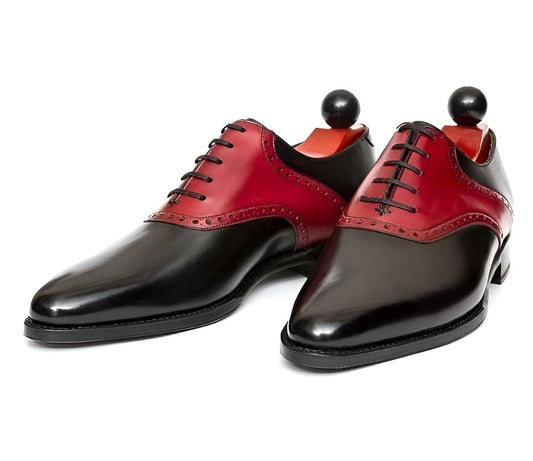 Black and red dress shoes on a white background