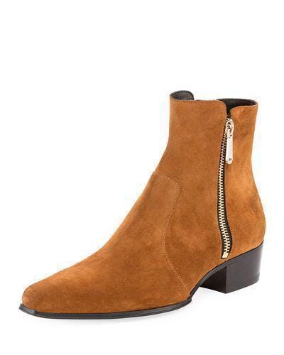 Brown suede ankle boot with a gold zipper on a white background